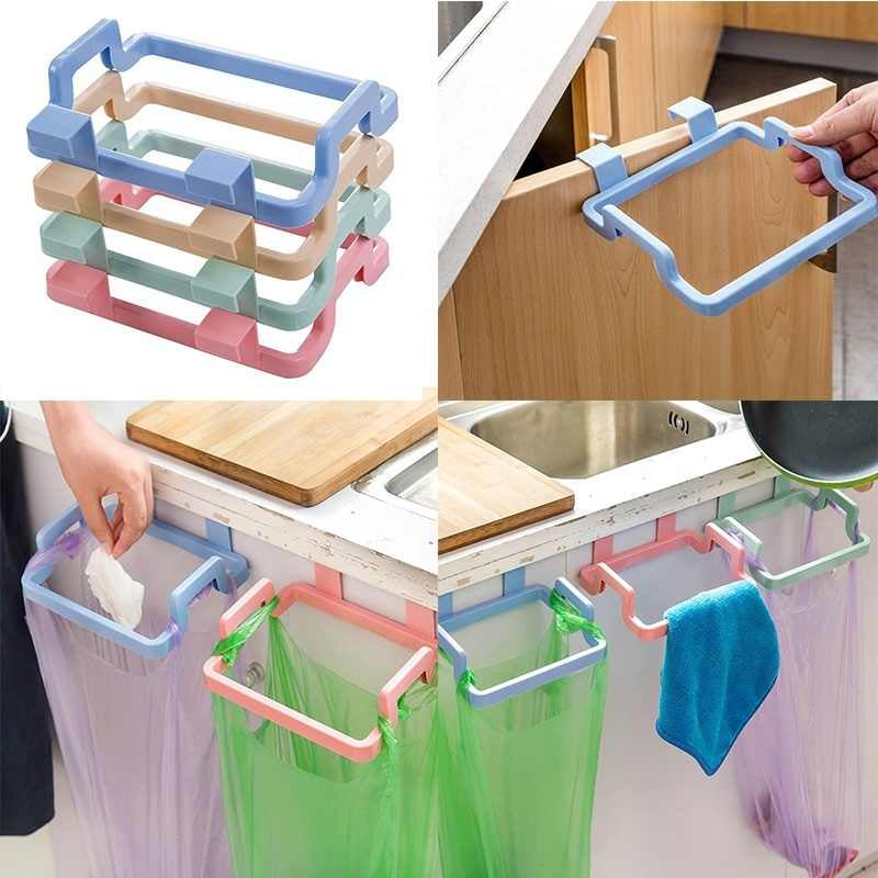This colorful, plastic, Attach-A-Trash hanging trash bag holder is designed to easily hang over kitchen cabinet doors for convenient waste disposal